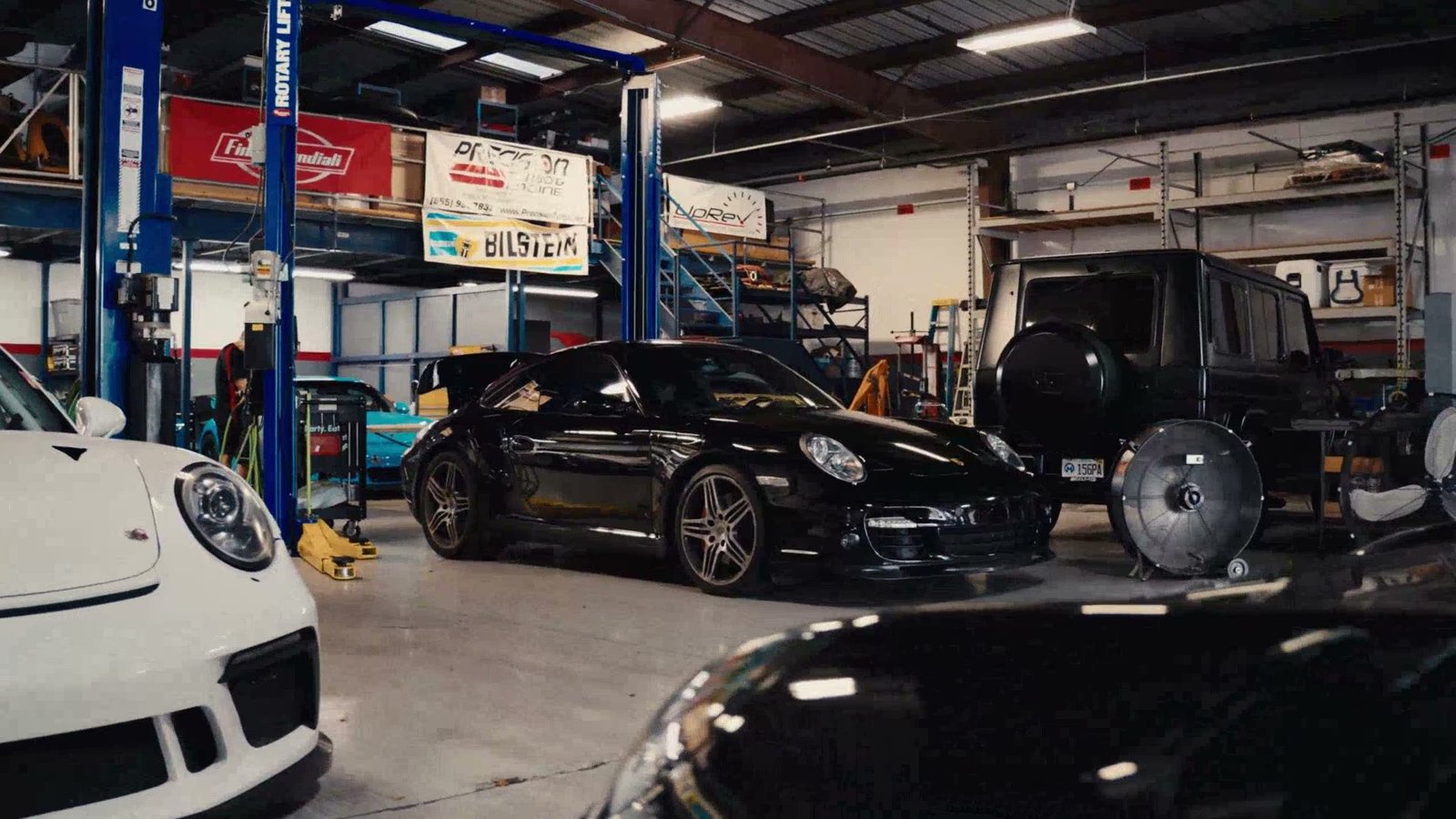 The Vortex Motorsport shop floor, lined with European sports cars